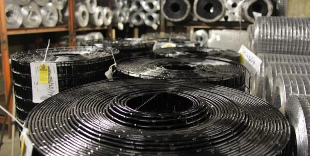 Coils of wire mesh on the warehouse shelves
