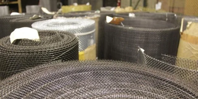Rolls of woven wire mesh on the floor