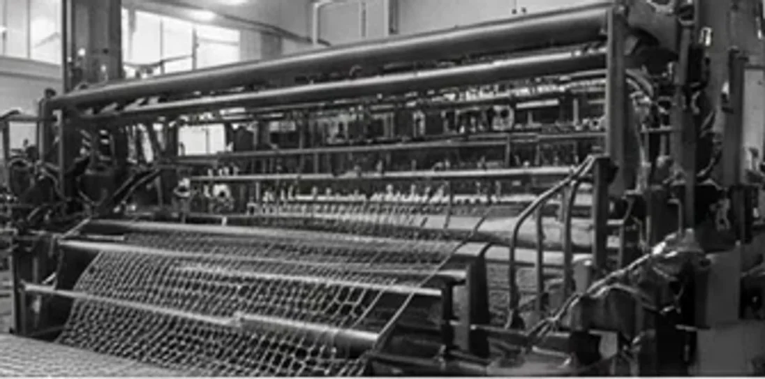 An early wire mesh loom on the Ferrier Wire shop floor